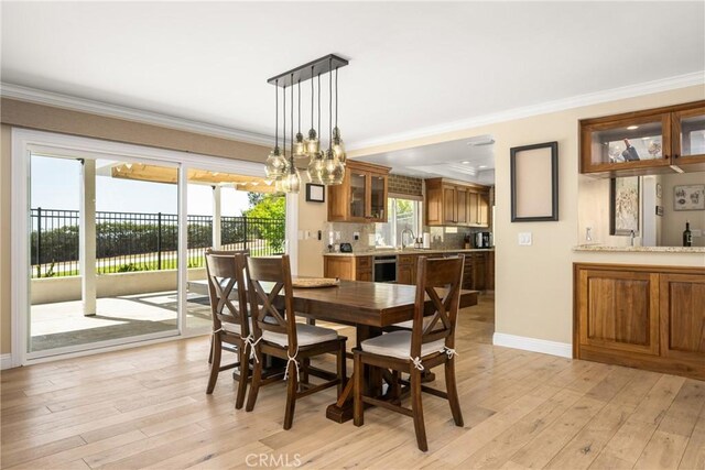 6021 Saddletree Ln, Yorba Linda, CA 92886 - dining space featuring ornamental molding, light wood-style flooring, and a chandelier