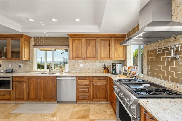 6021 Saddletree Ln, Yorba Linda, CA 92886 - kitchen featuring wall chimney exhaust hood, appliances with stainless steel finishes, crown molding, tasteful backsplash, and ceiling fan