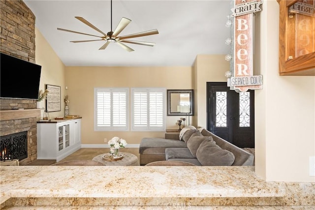 6021 Saddletree Ln, Yorba Linda, CA 92886 - living room with a fireplace, vaulted ceiling, ceiling fan, and french doors