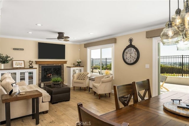 6021 Saddletree Ln, Yorba Linda, CA 92886 - living room with a ceiling fan, light wood-type flooring, crown molding, recessed lighting, and a lit fireplace
