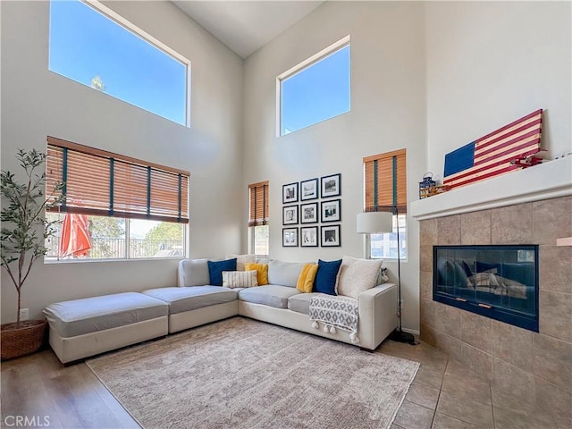 795 Donatello Dr, Corona, CA 92882 - living area with plenty of natural light, a tiled fireplace, and a high ceiling