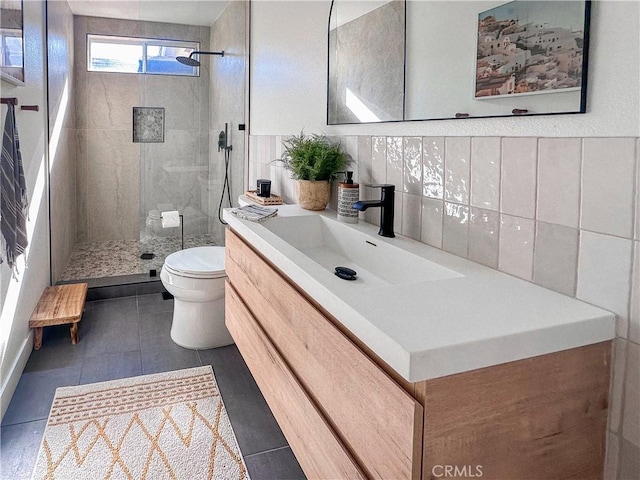 795 Donatello Dr, Corona, CA 92882 - bathroom with vanity, a tile shower, tile patterned floors, and backsplash