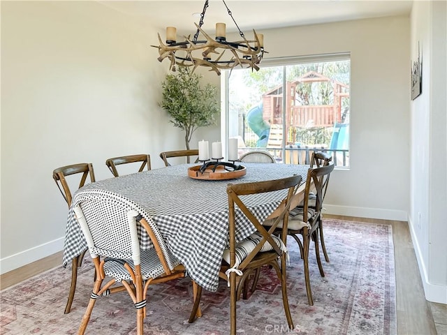 795 Donatello Dr, Corona, CA 92882 - dining area featuring a chandelier and light wood-style floors