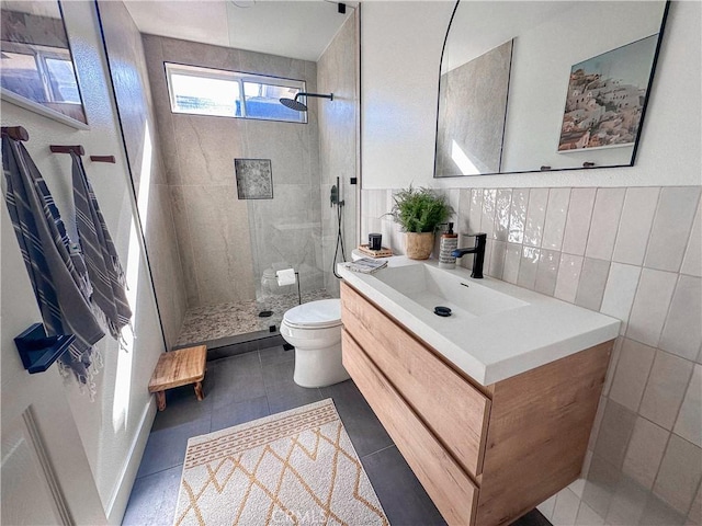795 Donatello Dr, Corona, CA 92882 - bathroom featuring vanity, tiled shower, tile walls, and tile patterned floors