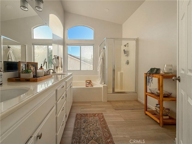 795 Donatello Dr, Corona, CA 92882 - full bathroom featuring a shower stall, a garden tub, double vanity, and wood finished floors