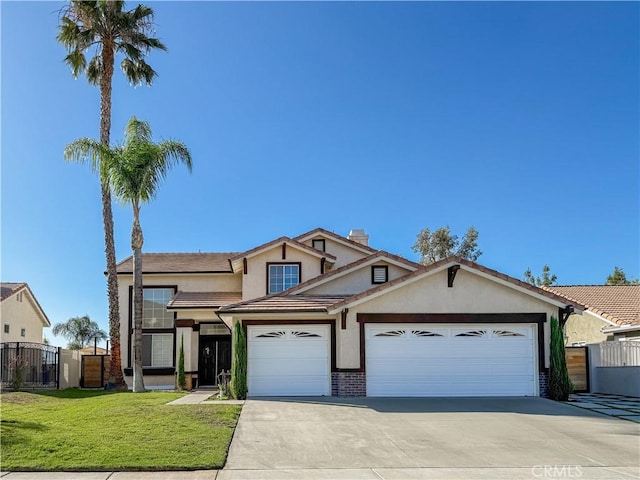 795 Donatello Dr, Corona, CA 92882 - traditional home featuring stucco siding, concrete driveway, a garage, a gate, and brick siding