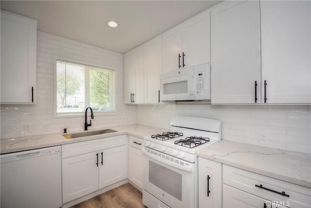 26769 Cherry Hills Blvd, Menifee, CA 92586 - kitchen featuring white appliances, a sink, white cabinetry, tasteful backsplash, and recessed lighting