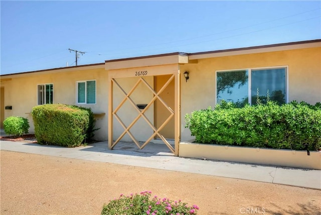 26769 Cherry Hills Blvd, Menifee, CA 92586 - entrance to property with stucco siding