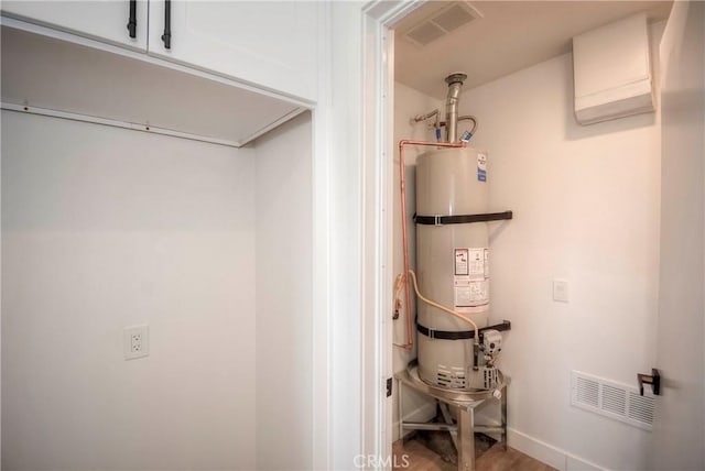 26769 Cherry Hills Blvd, Menifee, CA 92586 - utility room featuring strapped water heater