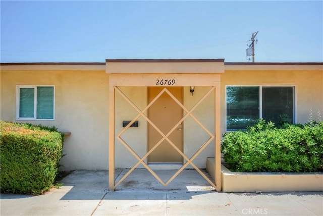 26769 Cherry Hills Blvd, Menifee, CA 92586 - entrance to property featuring stucco siding