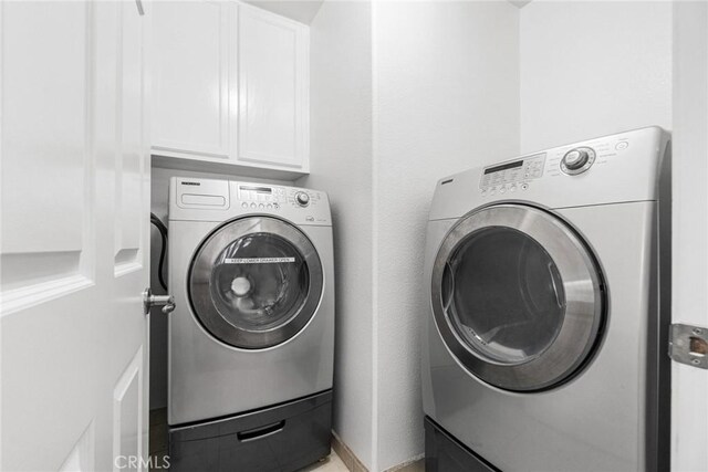 24545 Santa Clara Ave, Dana Point, CA 92629 - laundry room featuring separate washer and dryer and cabinet space