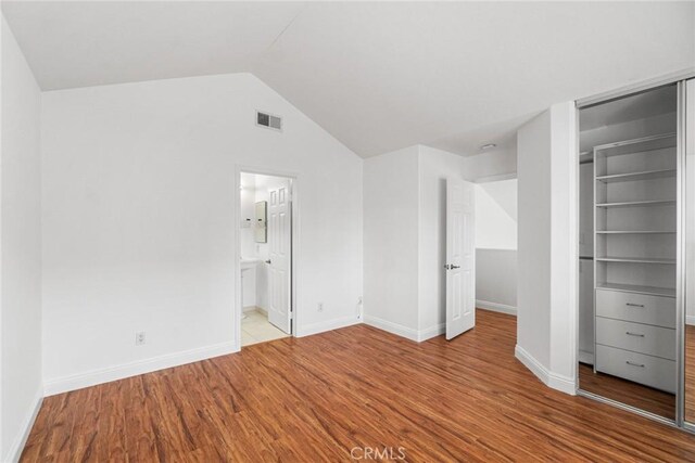 24545 Santa Clara Ave, Dana Point, CA 92629 - unfurnished bedroom with wood finished floors, lofted ceiling, and a closet