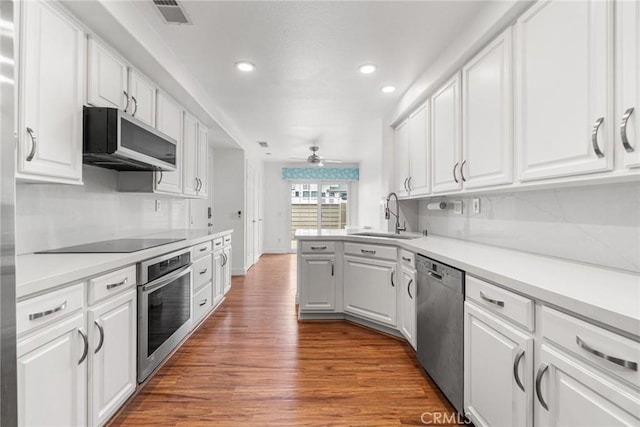 24545 Santa Clara Ave, Dana Point, CA 92629 - kitchen featuring appliances with stainless steel finishes, recessed lighting, white cabinetry, ceiling fan, and wood finished floors