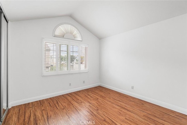 24545 Santa Clara Ave, Dana Point, CA 92629 - unfurnished room with wood finished floors and lofted ceiling