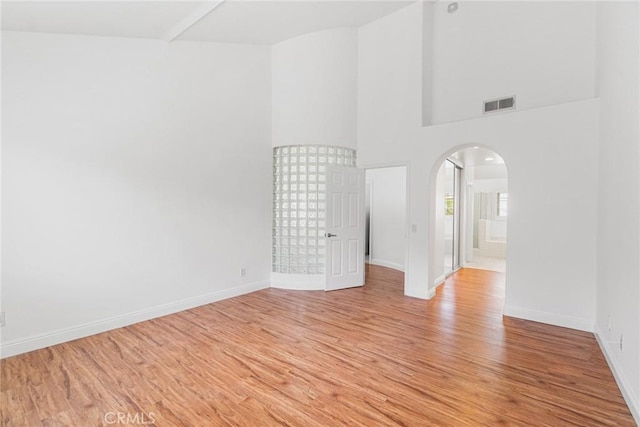 24545 Santa Clara Ave, Dana Point, CA 92629 - empty room with arched walkways and light wood finished floors