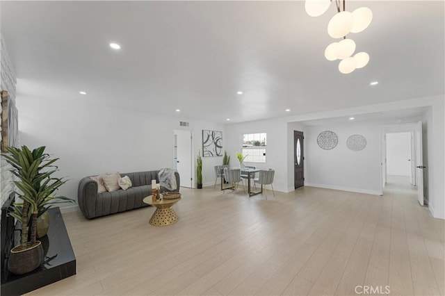 17121 Simonds St, Granada Hills, CA 91344 - living room with recessed lighting, light wood finished floors, a chandelier, and baseboards