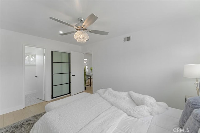17121 Simonds St, Granada Hills, CA 91344 - bedroom featuring wood finished floors, a ceiling fan, and baseboards