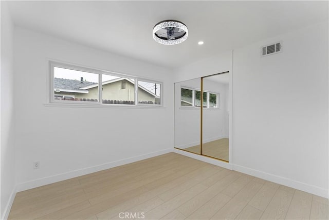 17121 Simonds St, Granada Hills, CA 91344 - unfurnished bedroom with light wood-style flooring, baseboards, a closet, and recessed lighting