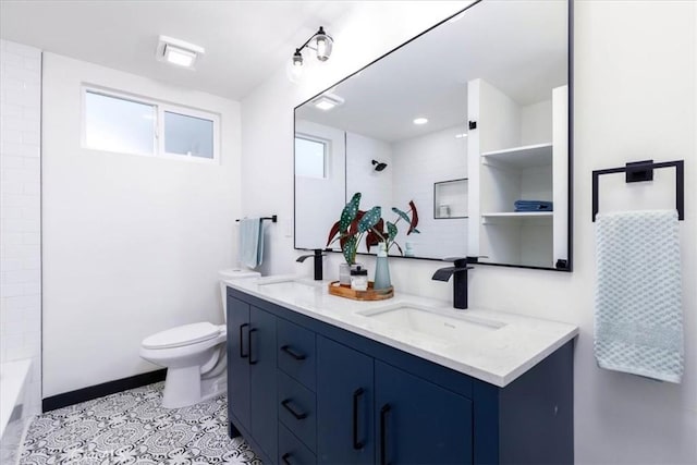 12009 Dresden Pl, Granada Hills, CA 91344 - bathroom with double vanity, toilet, bathing tub / shower combination, and baseboards