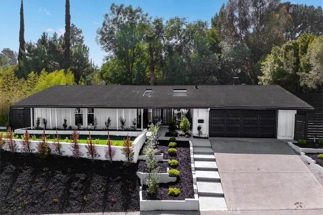 12009 Dresden Pl, Granada Hills, CA 91344 - view of front of property featuring an attached garage and driveway