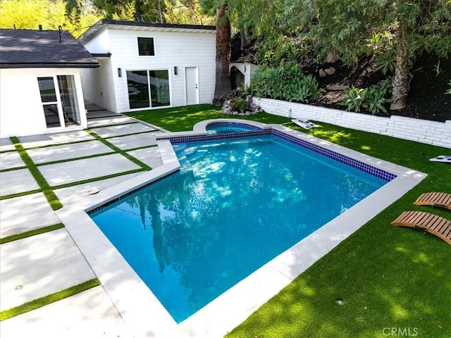 12009 Dresden Pl, Granada Hills, CA 91344 - view of pool featuring a patio area, a lawn, and a pool with connected hot tub