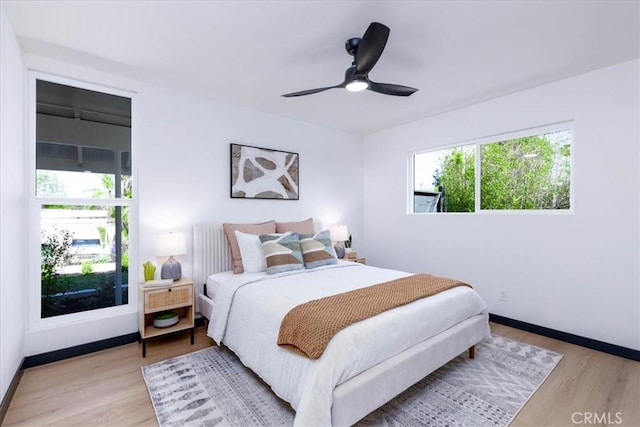 12009 Dresden Pl, Granada Hills, CA 91344 - bedroom featuring light wood-type flooring, baseboards, and a ceiling fan