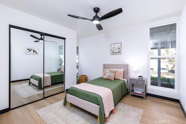 12009 Dresden Pl, Granada Hills, CA 91344 - bedroom with light wood-style flooring, ceiling fan, a closet, and baseboards