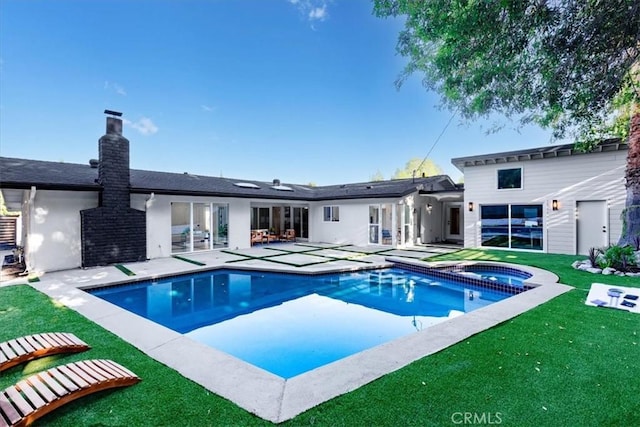 12009 Dresden Pl, Granada Hills, CA 91344 - rear view of property with a yard, a patio area, a chimney, and a pool with connected hot tub