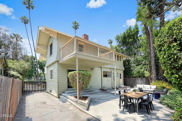 1920 Fletcher Ave, South Pasadena, CA 91030 - back of property with a balcony, a patio, outdoor dining space, and a chimney