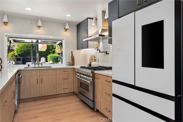 19851 Malaga Ln, Yorba Linda, CA 92886 - kitchen featuring appliances with stainless steel finishes, wall chimney range hood, backsplash, light wood finished floors, and light brown cabinetry