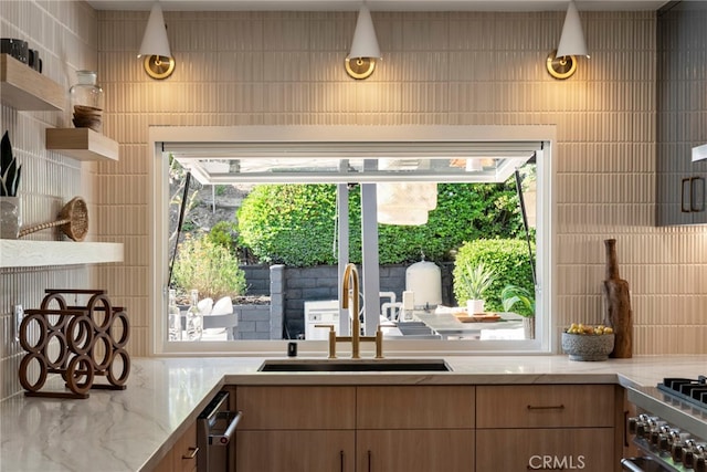 19851 Malaga Ln, Yorba Linda, CA 92886 - kitchen with plenty of natural light, light stone countertops, backsplash, and open shelves