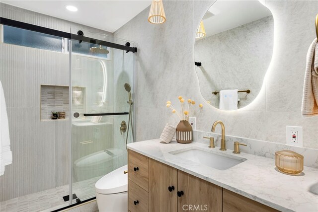 19851 Malaga Ln, Yorba Linda, CA 92886 - bathroom with vanity, a shower stall, tile walls, and backsplash