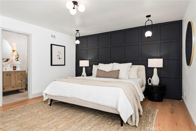 19851 Malaga Ln, Yorba Linda, CA 92886 - bedroom with a decorative wall, light wood-type flooring, and connected bathroom