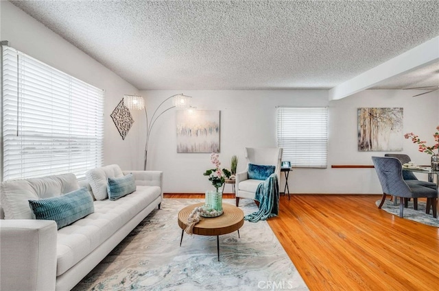 1206 W 187th Pl, Gardena, CA 90248 - living area featuring a textured ceiling, healthy amount of natural light, and light wood-style floors