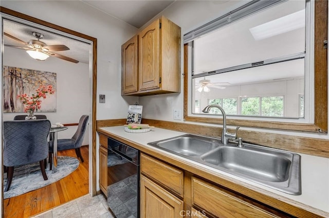 1206 W 187th Pl, Gardena, CA 90248 - kitchen featuring black dishwasher, a sink, a ceiling fan, and light countertops