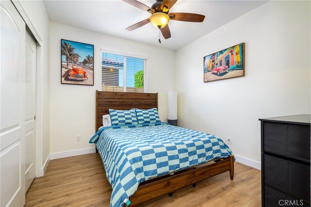 84290 Tramonto Way, Indio, CA 92203 - bedroom featuring light wood finished floors, baseboards, a closet, and a ceiling fan