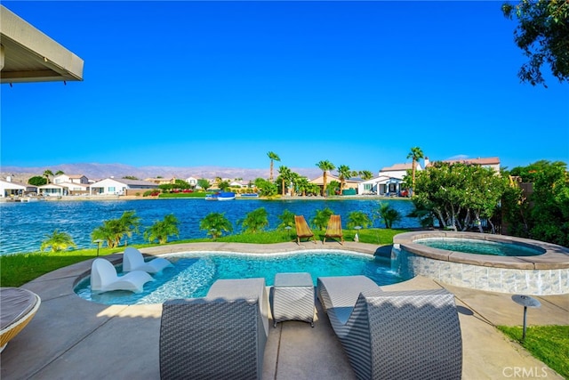 84290 Tramonto Way, Indio, CA 92203 - view of pool featuring a pool with connected hot tub, a residential view, a water view, and a patio