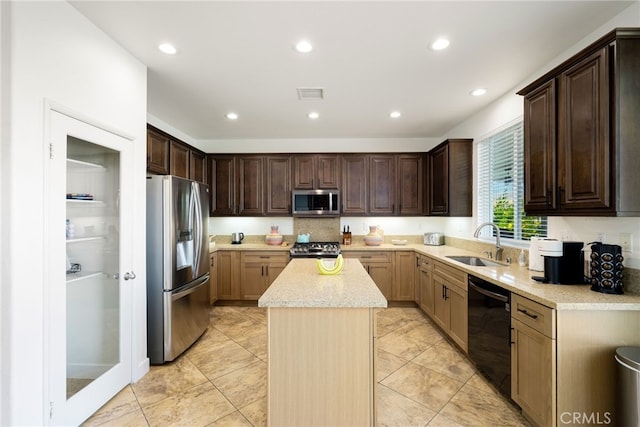 84290 Tramonto Way, Indio, CA 92203 - kitchen featuring appliances with stainless steel finishes, a sink, a kitchen island, recessed lighting, and dark brown cabinetry