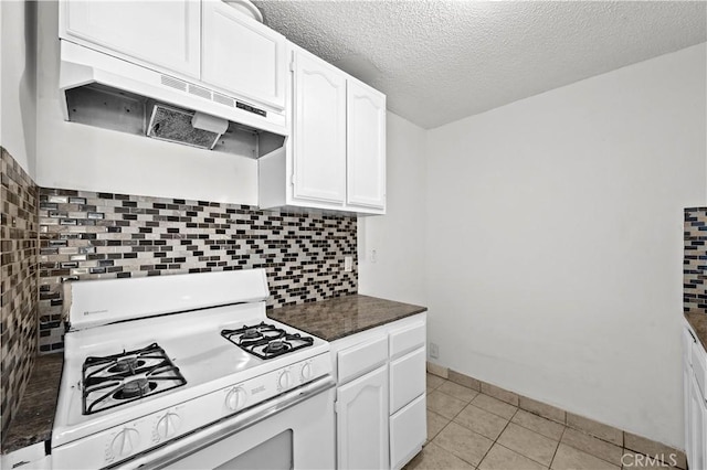 18620 Hatteras St Unit 274, Tarzana, CA 91356 - kitchen featuring gas range gas stove, ventilation hood, white cabinets, dark countertops, and decorative backsplash