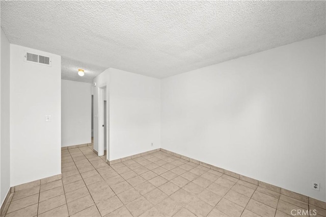 18620 Hatteras St Unit 274, Tarzana, CA 91356 - empty room featuring a textured ceiling and light tile patterned floors
