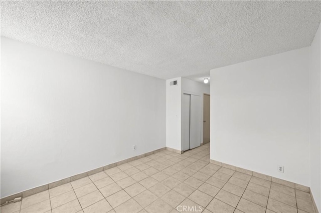18620 Hatteras St Unit 274, Tarzana, CA 91356 - spare room with a textured ceiling and baseboards