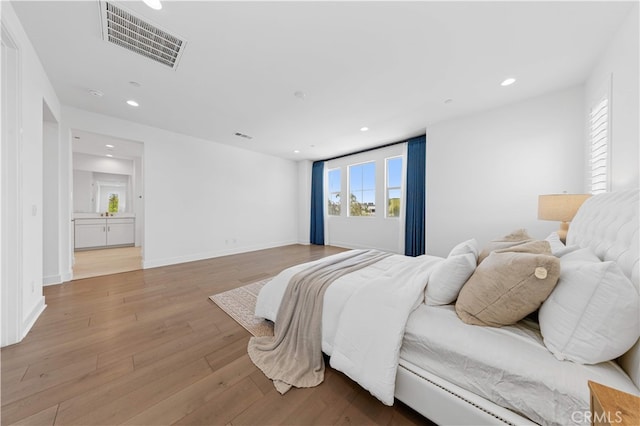 112 Sentosa, Irvine, CA 92618 - bedroom with recessed lighting, light wood-style floors, and baseboards