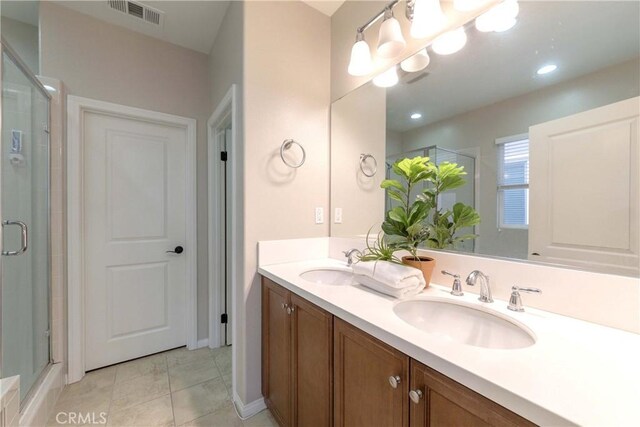 1123 Klose Ln, Fullerton, CA 92833 - full bathroom featuring a shower with door, double vanity, and tile patterned flooring