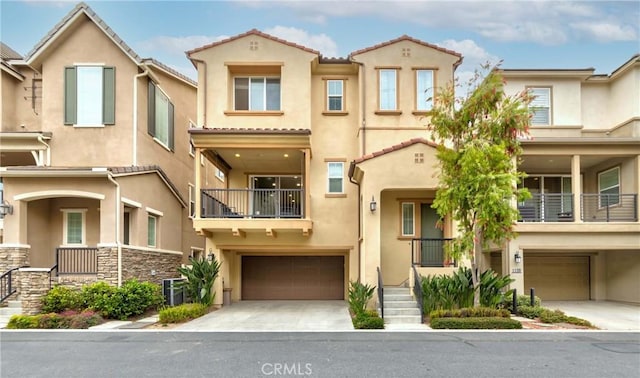 1123 Klose Ln, Fullerton, CA 92833 - multi unit property featuring an attached garage, stucco siding, and driveway