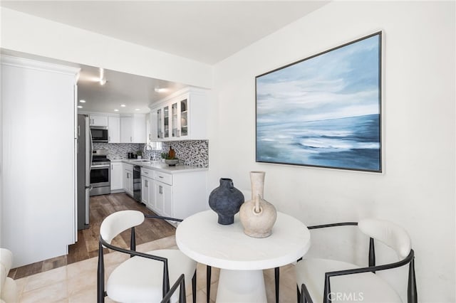 3012 W Oceanfront, Newport Beach, CA 92663 - dining area with wood finished floors and recessed lighting