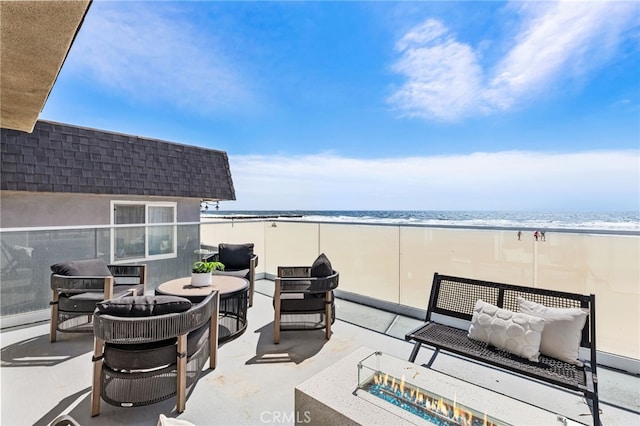 3012 W Oceanfront, Newport Beach, CA 92663 - view of patio with an outdoor living space with a fire pit and view of water and beach
