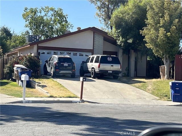 2605 Auburn Ct, Bakersfield, CA 93306 - view of front of property with concrete driveway, an attached garage, and stucco siding