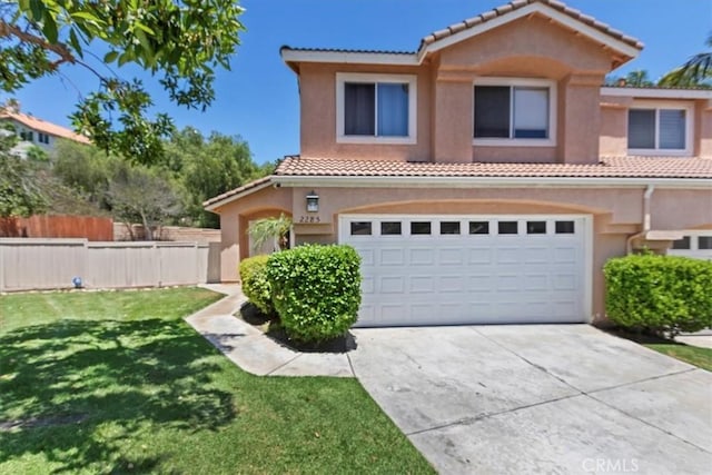 2285 Arabian Way, Corona, CA 92879 - mediterranean / spanish home featuring a tile roof, stucco siding, a garage, and driveway
