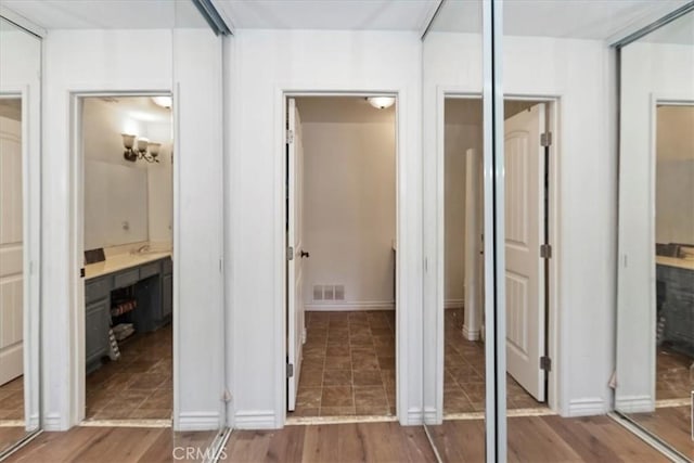2285 Arabian Way, Corona, CA 92879 - unfurnished bedroom with ensuite bath and wood finished floors
