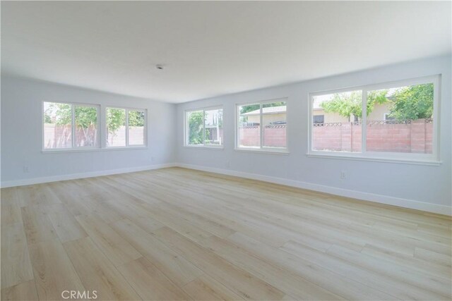 25411 Cottage Ave, Loma Linda, CA 92354 - empty room featuring light wood-style flooring and baseboards